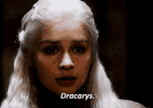 a close up of a woman 's face with the word dracarys written on it .