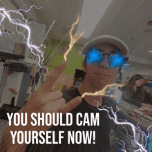 a man wearing sunglasses with lightning behind him and the words you should cam yourself now