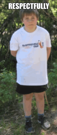 a young boy wearing a slottsfjellet cup shirt