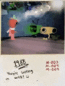 a blurry picture of a cartoon character standing next to a green robot .