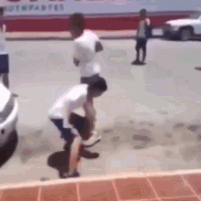 a group of people are standing on a sidewalk in front of a white car and a sign that says toyota