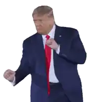 a man in a suit and tie is dancing with his fist in the air