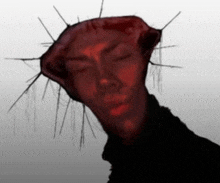 a drawing of a person with a red face and a crown of thorns on their head