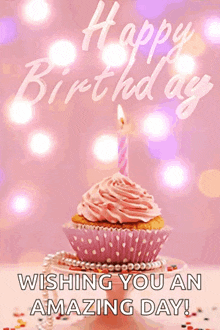 a birthday card with a pink cupcake and a candle