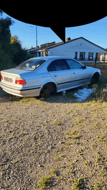 a silver car with a license plate that says ' aa ' on it