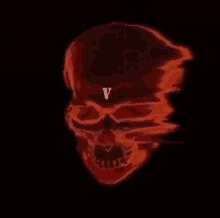 a red skull with the letter v on it 's forehead