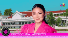 a woman in a pink jacket stands in front of a building with the words presidential address on the bottom