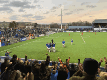 a soccer game is being played in a stadium with a toyota ad on the sidelines