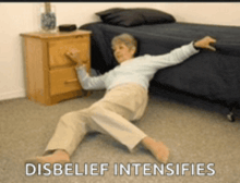 an older woman is laying on the floor with the words disbelief intensifies written below her