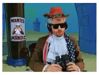 a man in a cowboy hat is looking through binoculars in front of a wanted poster