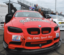 a red race car that says the little speed shop