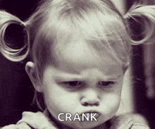 a little girl with pigtails is making a funny face with the word crank above her head