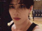 a close up of a young man 's face in a gym .