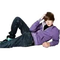 a young man in a purple sweatshirt is laying down on the floor