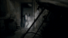 a blue light is shining through a doorway in a dark room