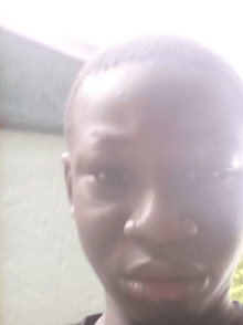 a blurry picture of a young boy 's face