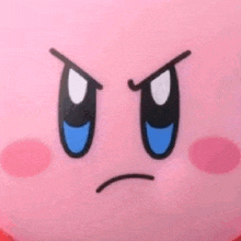 a close up of kirby 's face with an angry look on his face .