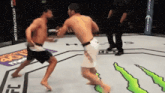 two fighters are fighting in a ring with a monster energy sign in the background