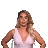 a woman in a pink dress with a plunging neckline
