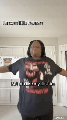 a woman is wearing a black shirt that says i have a little bounce but not like my lil sister