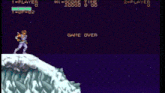 a video game screen shows a man jumping off a cliff and says game over