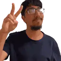 a man with glasses and a beard giving the peace sign