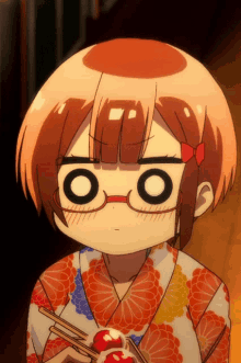 a girl wearing glasses and a kimono holds a red ball