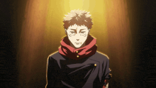 a man with a red scarf around his neck stands in front of a yellow light
