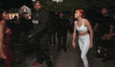 a blurry photo of people dancing with the word zeus visible in the corner