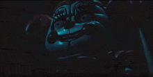 a cartoon character with glowing eyes is standing in the dark .