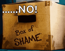 a cardboard box that says " box of shame " on it