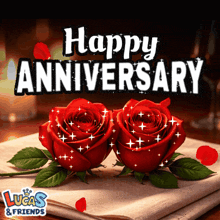 two red roses on a napkin with the words happy anniversary above them
