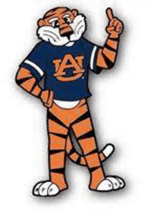 a cartoon of a tiger mascot wearing a blue shirt and pointing up .