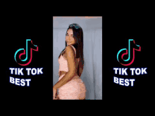 a woman in a pink dress and sunglasses is standing in front of a tik tok logo .