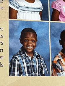 a boy in a plaid shirt smiles for a photo