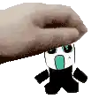 a hand is holding a cartoon character with a surprised look on his face .