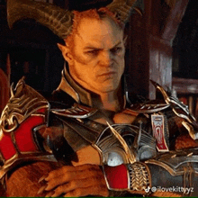 a man with horns is wearing armor and a red shirt