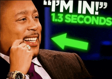 a man is smiling in front of a sign that says " i 'm in " 1.3 seconds
