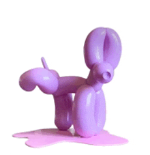 a purple balloon dog statue is standing on a pink surface .