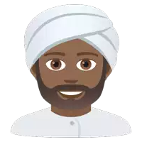 a man with a beard wearing a white turban and smiling