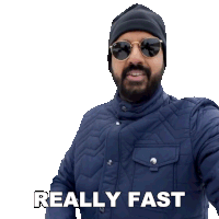 a man wearing sunglasses and a beanie has the words really fast above him