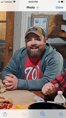 a man with a beard wearing a shirt that says 70