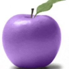 a purple apple with a green leaf on top of it .