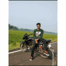 a man is sitting on a motorcycle with a license plate that says aec on it