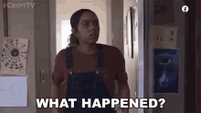 a woman in overalls is standing in a hallway and asking what happened