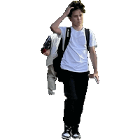 a young man wearing a white shirt and black pants is walking