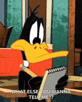 a cartoon duck is holding a notebook and a pencil and asking what else you wanna tell me .