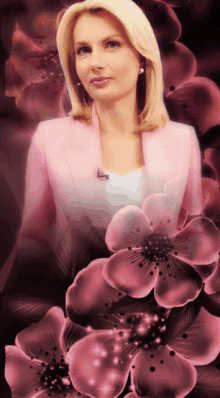 a woman in a pink jacket is surrounded by pink flowers on a dark background