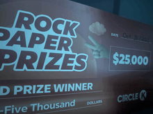 a check that says rock paper prizes and a prize winner of $ 25,000