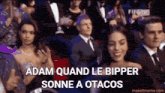 adam quand le bipper sonne a otacos is written in a crowd of people